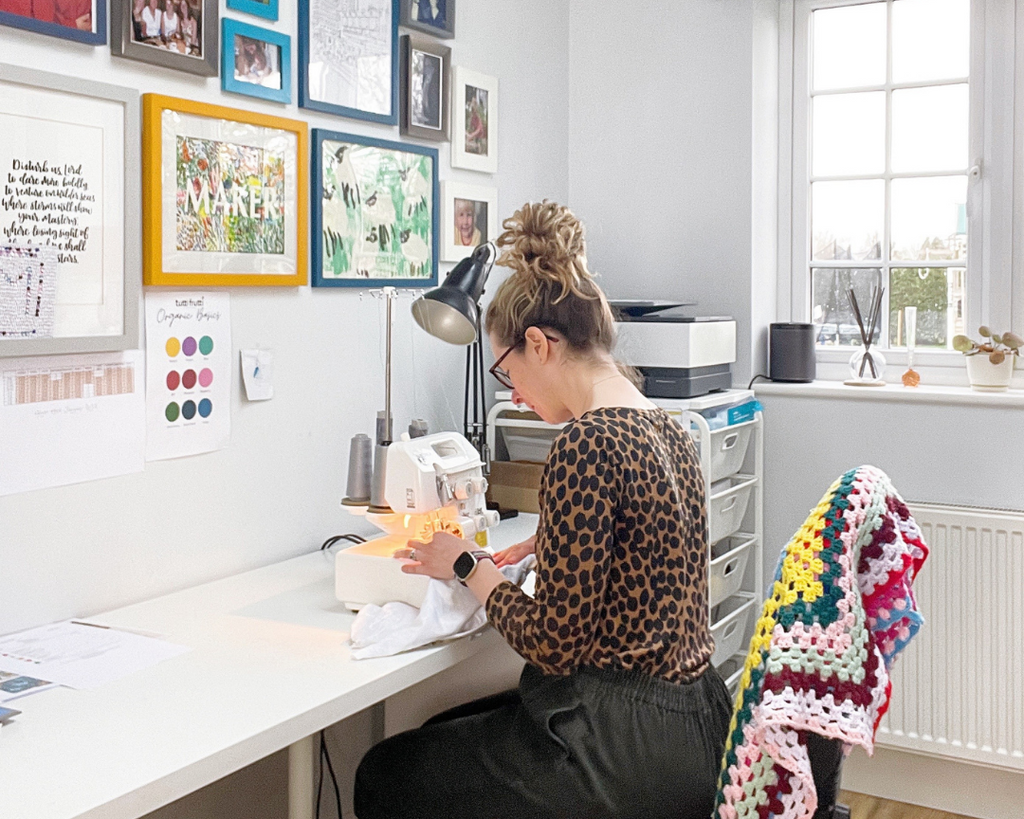 Ali sewing at her machine